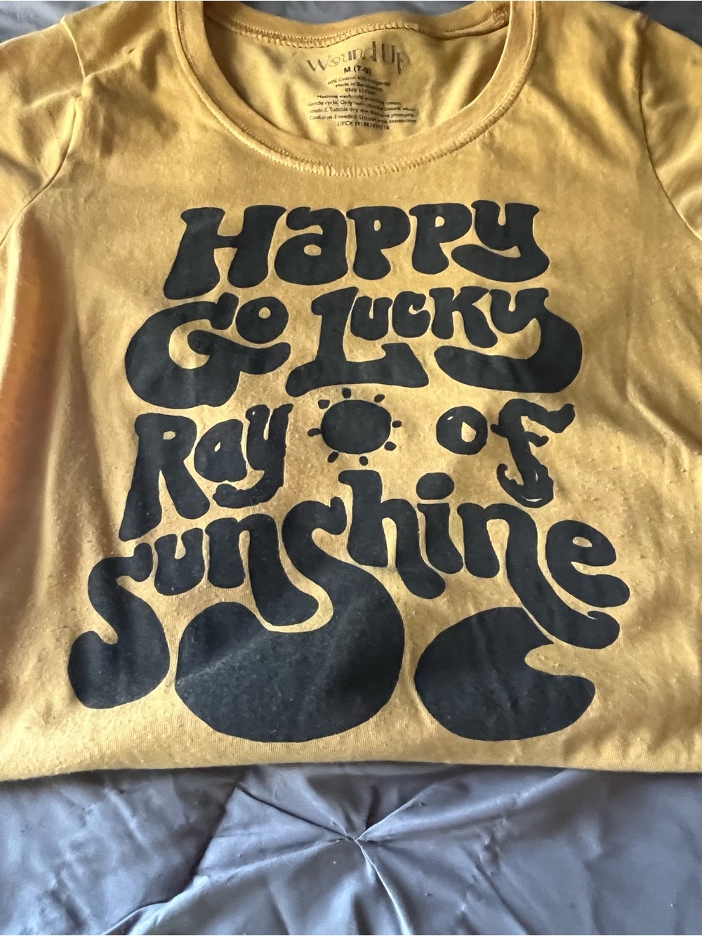 Wound Up Yellow Tee with Bold Black 'Happy Go Lucky Ray of Sunshine' Graphic